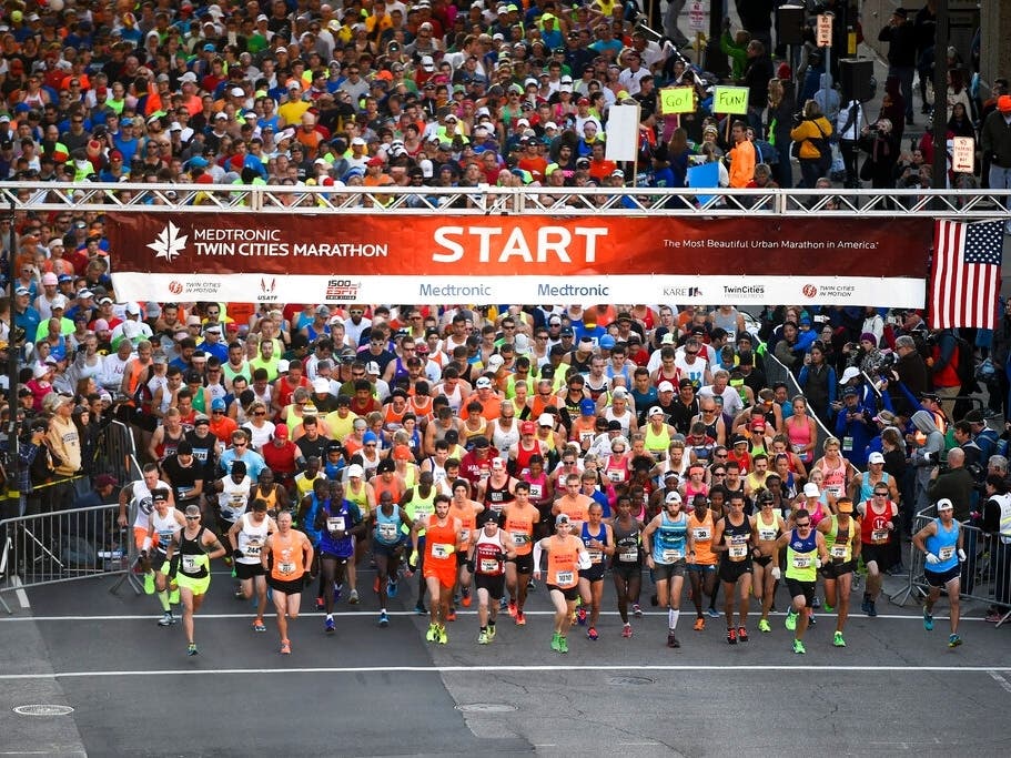 Runners head out at the start of the Twin Cities Marathon, Sunday, Oct. 4, 2015, in Minneapolis.
