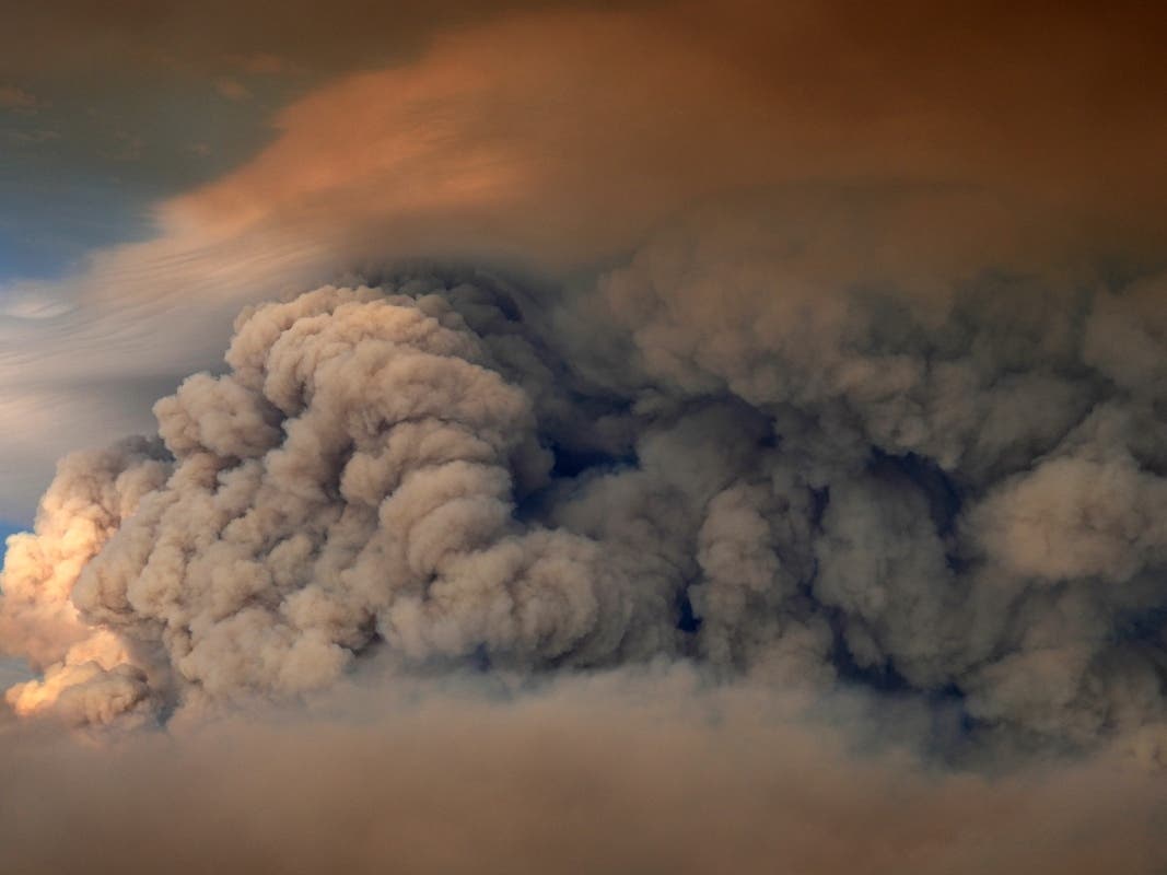 A plumes of smoke from the Camp Fire hang in the air over Moose Lake as multiple wildfires burn in Minnesota's Boundary Waters Canoe Area Wilderness, Tuesday, July 14, 2026.
