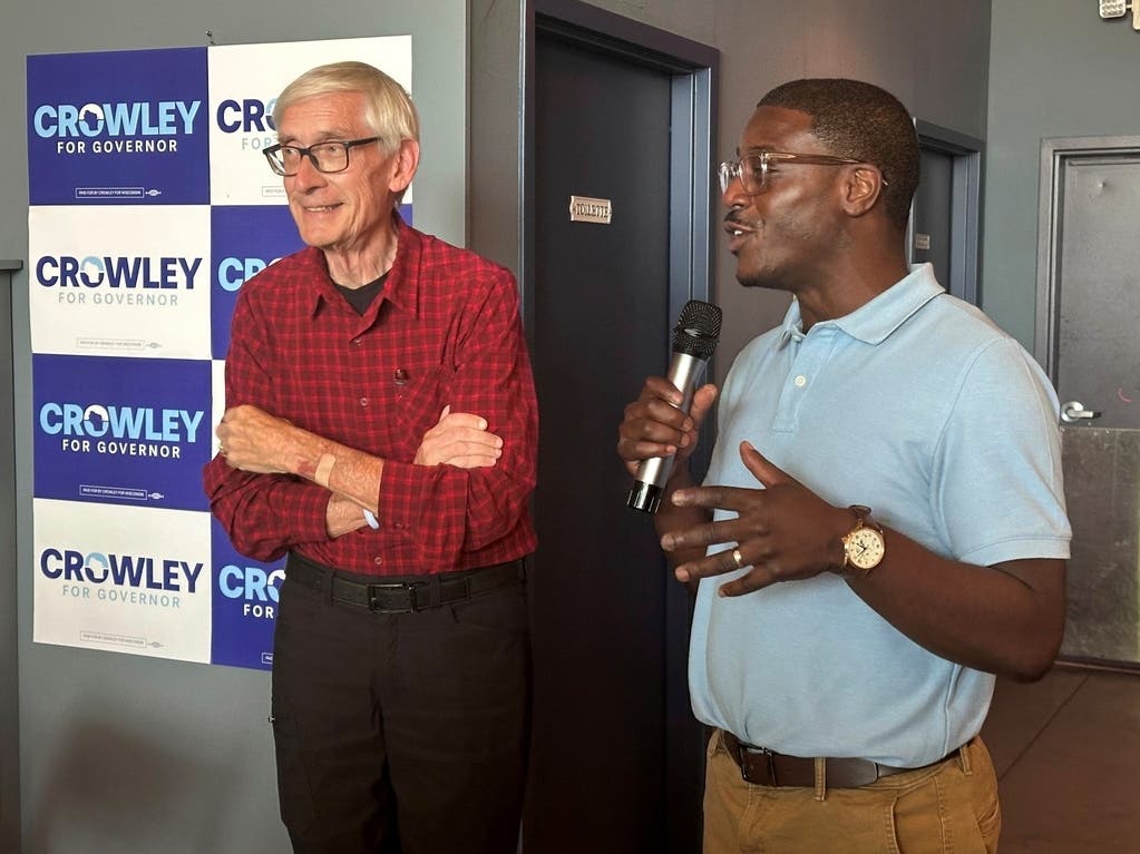 Wisconsin Gov. Tony Evers, left, campaigns with Democratic candidate for Governor David Crowley, right, Monday, Aug. 10, 2026, in Madison, Wis. 