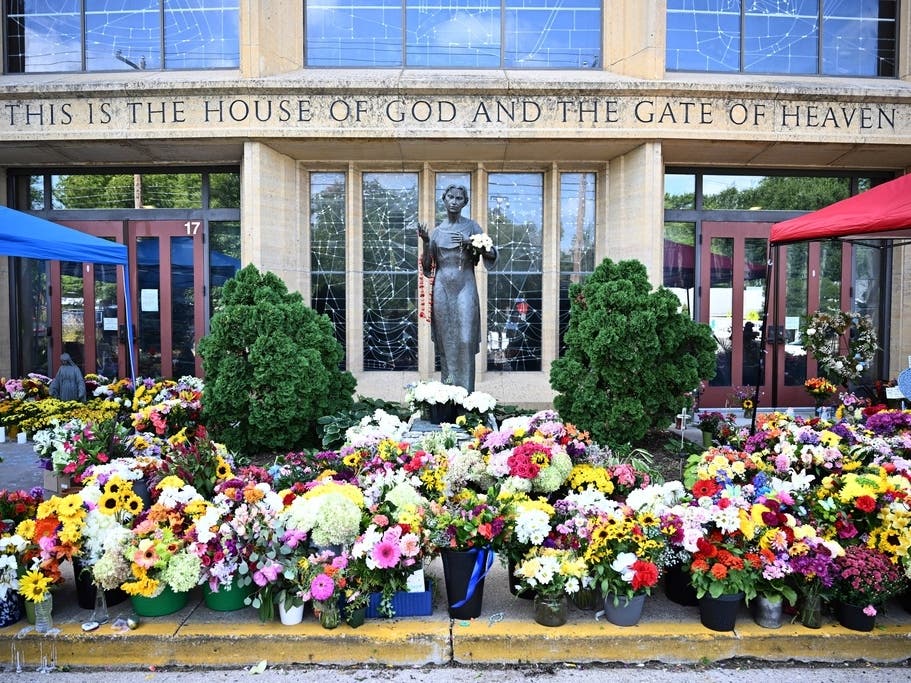 Flowers are seen outside the Annunciation Catholic Church in Minneapolis, Minn., on Sept. 3, 2025.
