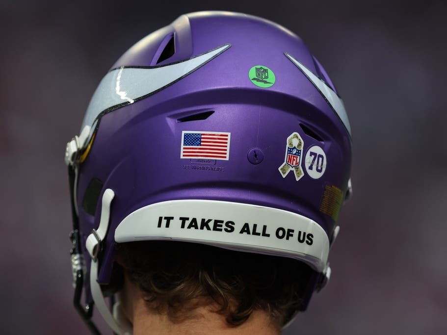 Minnesota Vikings quarterback J.J. McCarthy wears the NFL Salute to Service logo ribbon sticker on his helmet during an NFL football game against the Baltimore Ravens, Sunday, Nov. 9, 2025 in Minneapolis.