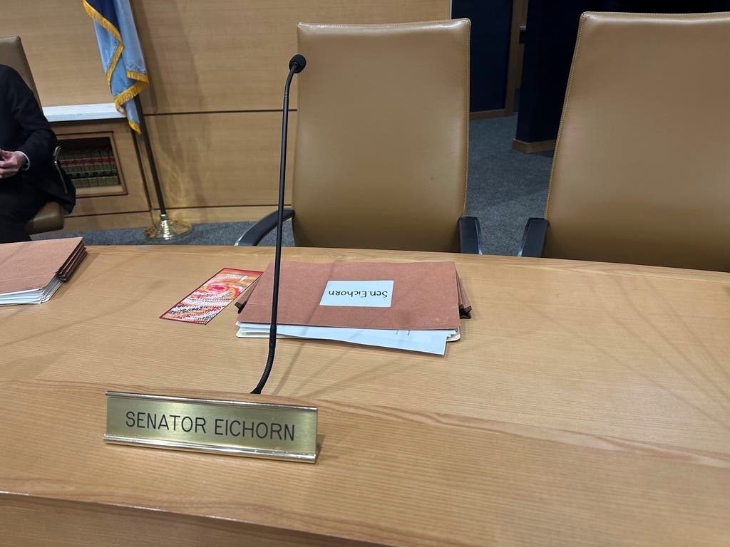 The chair for then-Minnesota state Sen. Justin Eichorn, a Republican from Grand Rapids, sits empty in a Senate hearing room in the State Capitol complex in St. Paul on March 18, 2025, a day after his arrest in Bloomington.