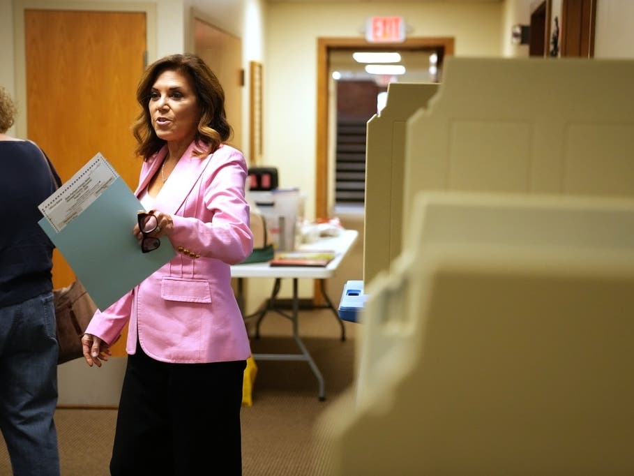 Michele Tafoya, a Republican candidate for U.S. Senate, holds her ballot after voting on Tuesday, Aug. 11, 2026, in Minneapolis.
