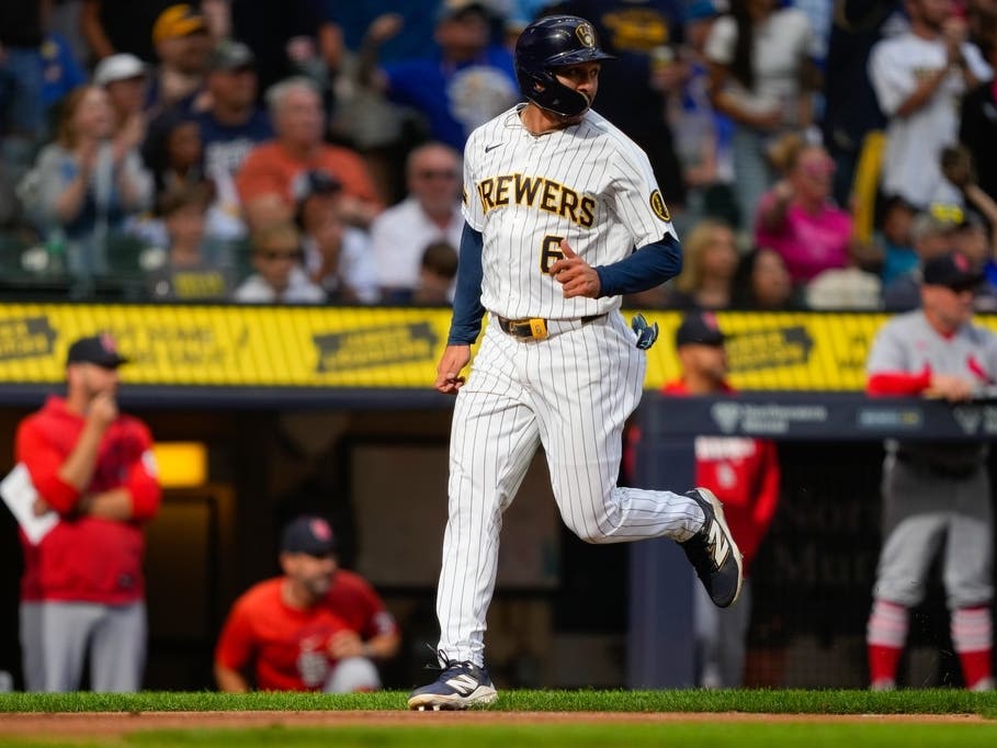 Milwaukee Brewers' David Hamilton scores on an RBI single hit by Jackson Chourio during the fourth inning of a baseball game against the St. Louis Cardinals, Sunday, Sept. 27, 2026, in Milwaukee.