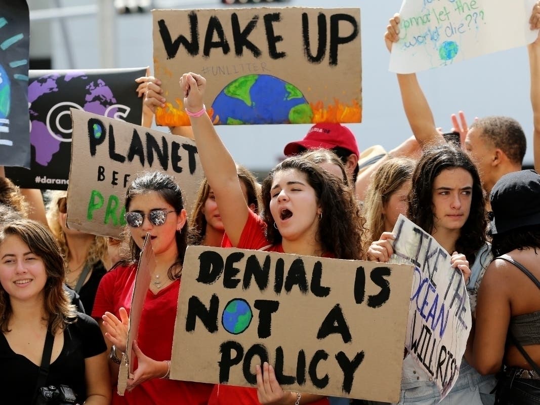 Students cheer during an international protest organized by the U.S. Youth Climate Strike Friday.