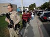 Students are escorted out of Saugus High School after reports of a shooting on Thursday, Nov. 14, 2019, in Santa Clarita, Calif.