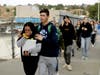 Students are escorted outside of Saugus High School after reports of a shooting on Thursday, Nov. 14, 2019, in Santa Clarita, Calif. Los Angeles County Sheriff Alex Villanueva tweeted that the suspect was in custody and was being treated at a hospital. 