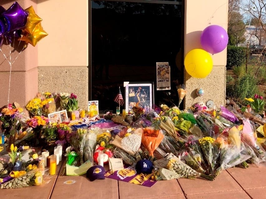 A memorial is set up outside Mamba Sports Academy in Thousand Oaks, California, for the nine friends, family and teammates killed in Sunday's helicopter crash.
