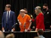 Joseph James DeAngelo, center, charged with being the Golden State Killer, his helped up by his attorney, Diane Howard, as Sacramento Superior Court Judge Michael Bowman enters the courtroom in Sacramento, Calif. Monday.