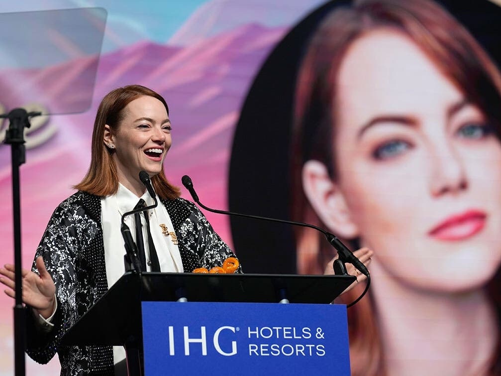 Emma Stone accepts the desert palm achievement actress award for "Poor Things" at the 35th annual Palm Springs International Film Festival Awards Gala on Thursday, Jan. 4, 2024, in Palm Springs, Calif.