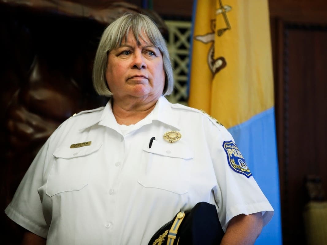 Philadelphia's acting Police Commissioner Christine Coulter listens as Mayor Jim Kenney speaks with members of the media during a news conference at City Hall in Philadelphia, Wednesday, Aug. 21, 2019.