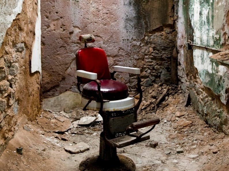 This Oct. 13, 2014, photo shows a barber shop in cellblock 10 at Eastern State Penitentiary in Philadelphia. The penitentiary took in its first inmate in 1829, closed in 1971 and reopened as a museum in 1994.