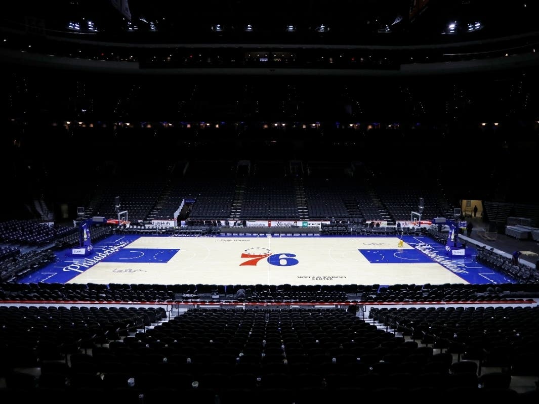 The empty court is seen at the Wells Fargo Center after an NBA basketball game between the Philadelphia 76ers and the Detroit Pistons, Wednesday, March 11, 2020, in Philadelphia.