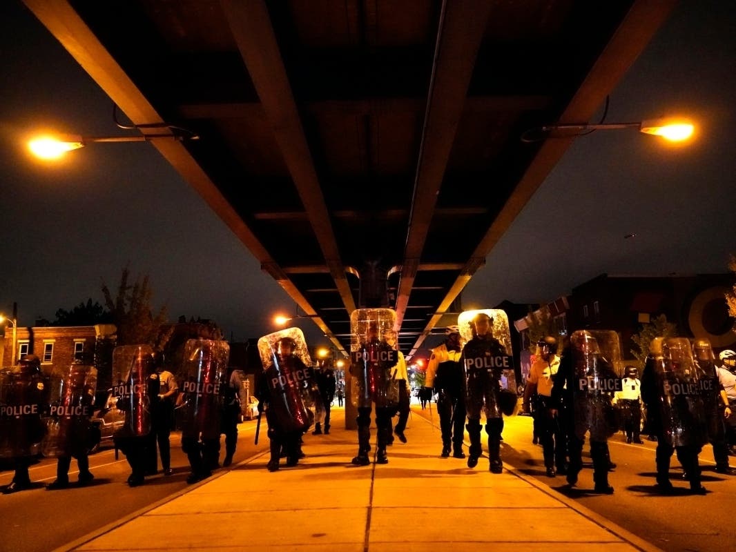 Philadelphia PPhiladelphia police officers form a line during a demonstration in Philadelphia, late Tuesday, Oct. 27, 2020.