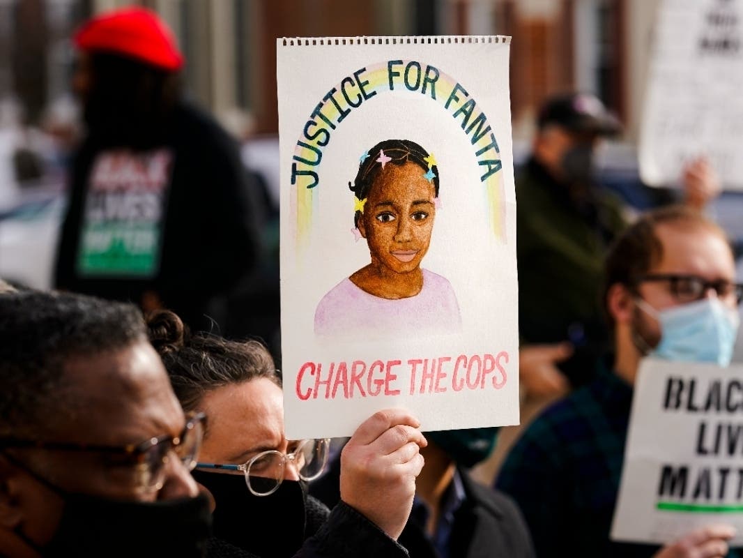 Protesters demonstrate calling for police accountability in the death of 8-year-old Fanta Bility who was shot outside a football game, at the Delaware County Courthouse in Media, Pa., Thursday, Jan. 13, 2022.
