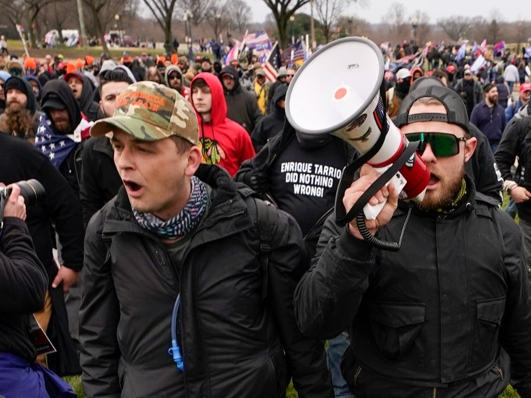 Proud Boys members Zachary Rehl, left, and Ethan Nordean, right, walk toward the U.S. Capitol in Washington, in support of President Donald Trump on Jan. 6, 2021