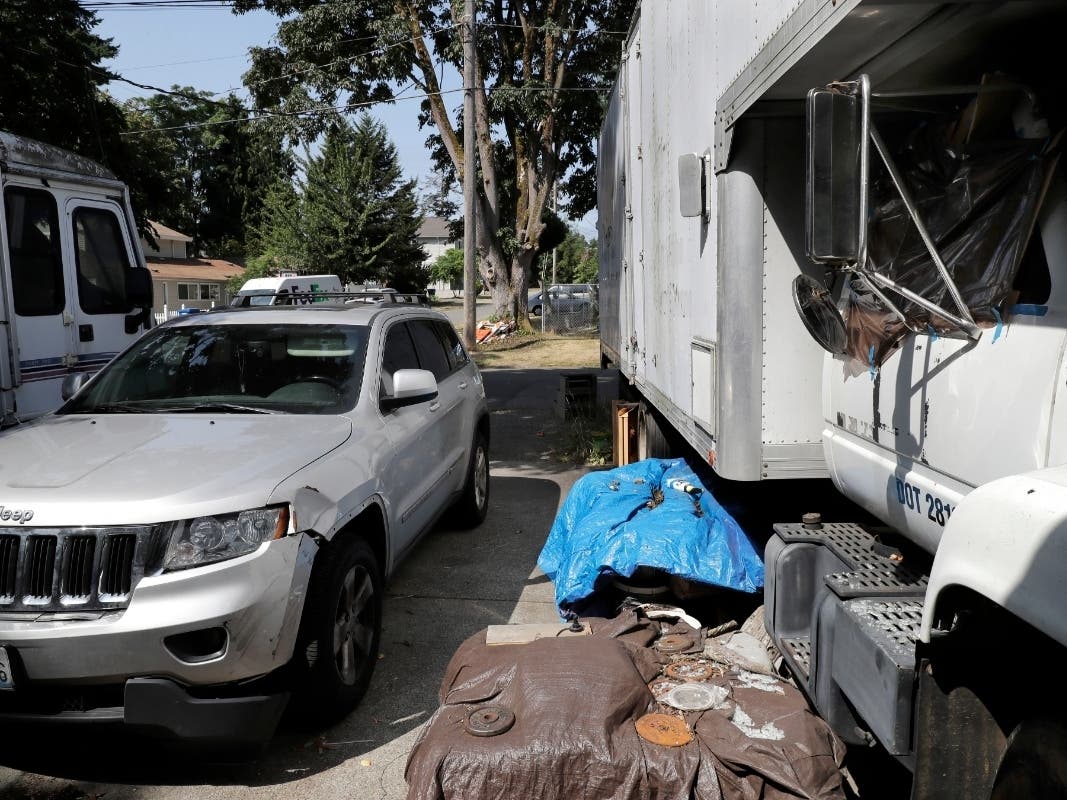 Vehicles parked outside the home of Paige A. Thompson, who uses the online handle "erratic," Wednesday, July 31, 2019, in Seattle.