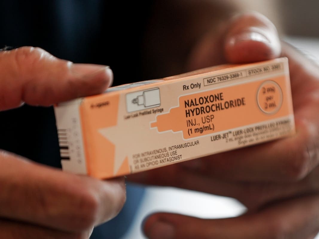 An Ohio fire medic shows off a box of Naloxone, which can reverse the effects of an opioid overdose. 