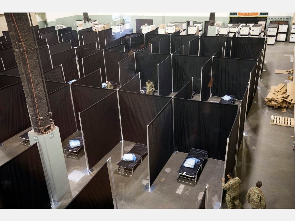 National Guard troops set up a field hospital inside the Worcester DCU Center April 1. The facility will house patients recovering from COVID-19.