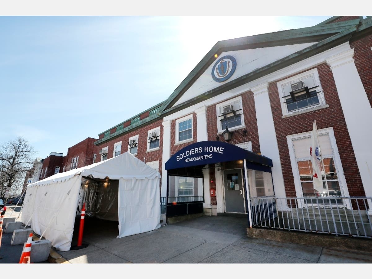A tent sits idle beside the entrance to the Soldiers' Home in Chelsea on April 6, where five people have died of coronavirus. Another 32 have died at the Holyoke Soldiers' Home.
