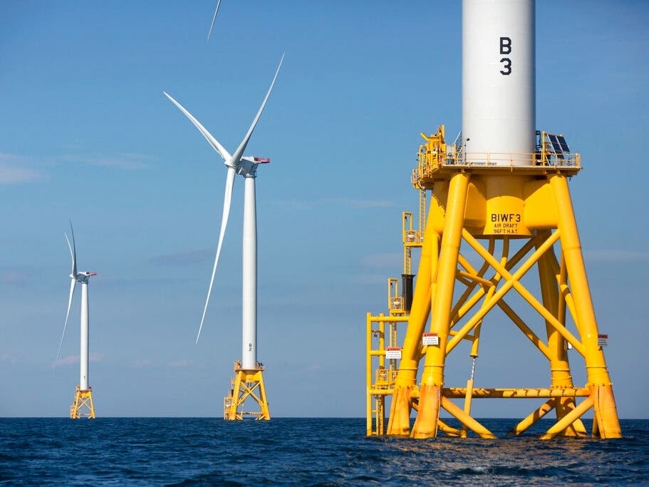 In this Aug. 15, 2016 file photo, three of Deepwater Wind's five turbines stand in the water off Block Island, R.I, the nation's first offshore wind farm. 