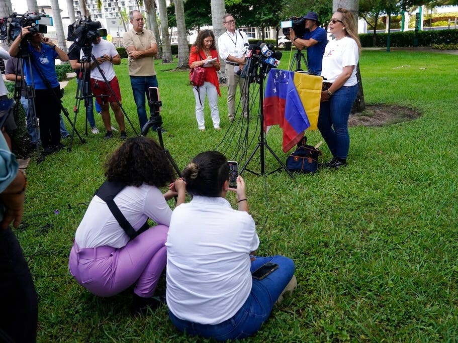 Adelys Ferro, director of the Venezuelan-American Caucus, speaks at a news conference on Sept. 15 in Doral, Fla. Ferro denounced Florida Gov. Ron DeSantis for chartering two planes to transport immigrants to Martha's Vineyard