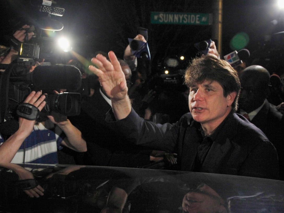 Former Illinois governor and "Celebrity Apprentice" contestant Rod Blagojevich departs his home to begin his 14-year prison sentence on corruption charges in March 2012. President Donald Trump said he is "strongly considering" commuting his sentence.