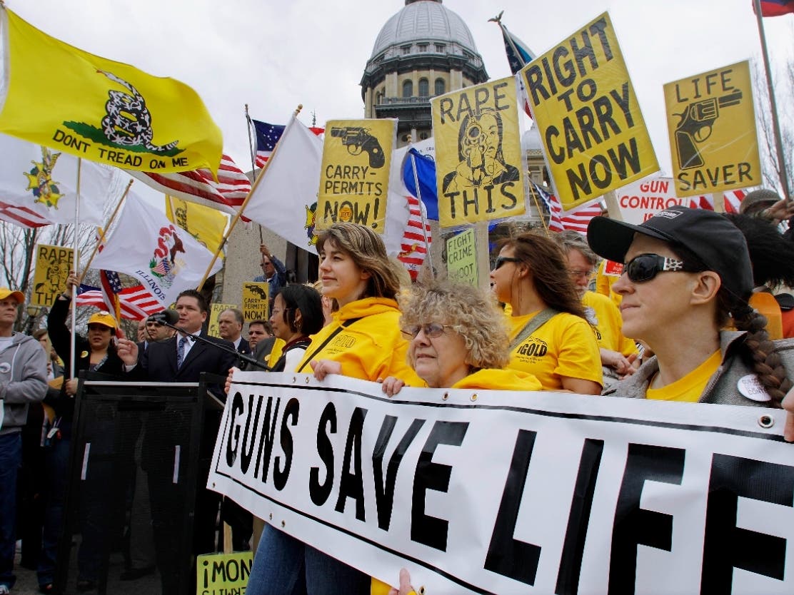 Members of the pro-gun group Guns Save Life rally outside the Illinois State Capitol in 2012. On Thursday, the Illinois Supreme Court sided with the group in a case challenging taxes on ammunition and firearms.