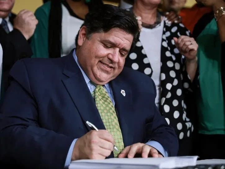 Gov. J.B. Pritzker, pictured signing a bill into law in 2019, on Monday signed Senate Bill 1169, an amendment to the Illinois Health Care Right of Conscience Act that is due to take effect next year.