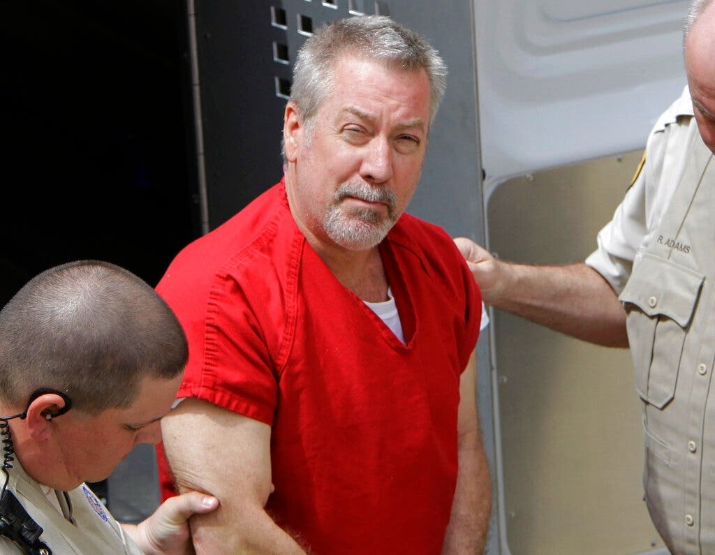 In this May 8, 2009 file photo, former Bolingbrook police sergeant Drew Peterson arrives at the Will County Courthouse in Joliet, for his arraignment on charges of first-degree murder in the 2004 death of his former wife Kathleen Savio.