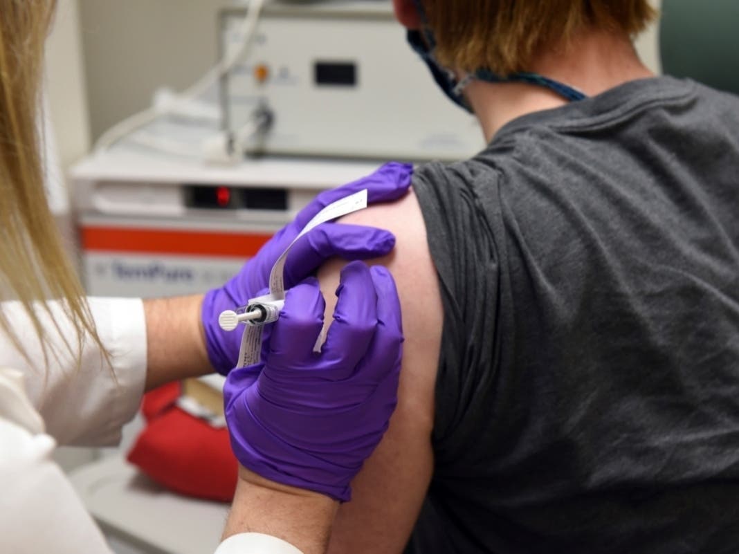 This May 4, 2020, file photo provided by the University of Maryland School of Medicine, shows the first patient enrolled in Pfizer's COVID-19 coronavirus vaccine clinical trial at the University of Maryland School of Medicine in Baltimore.