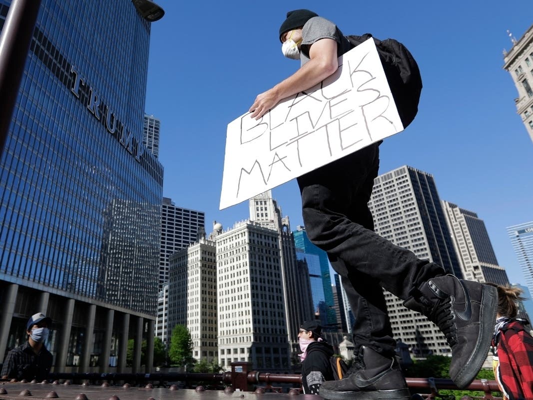 Demonstrators gather in Chicago to protest the death of George Floyd. 