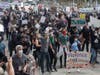 People listen to speakers at a protest over the Memorial Day death of George Floyd, a handcuffed black man in police custody in Minneapolis, in San Francisco, Saturday, May 30, 2020.
