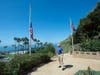 Former San Clemente Mayor Wayne Eggleston looks back after lowering the U.S. flag to half-staff at Park Semper Fi in San Clemente, Calif., on Friday, July 31, 2020.