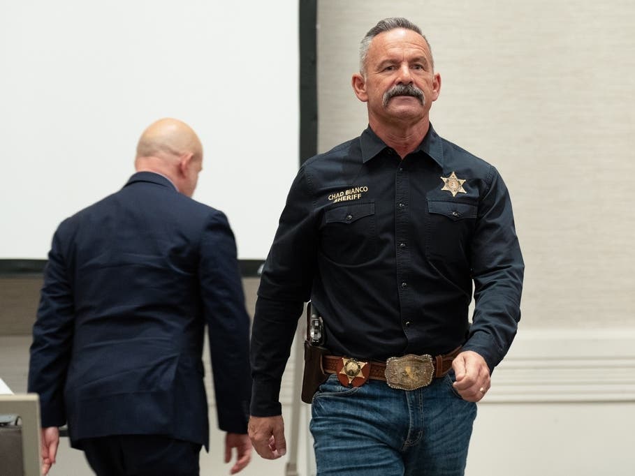California gubernatorial candidates Chad Bianco and Steve Hilton, background left, cross paths at the California Republican Party Convention in San Diego on Friday, April 10, 2026. 