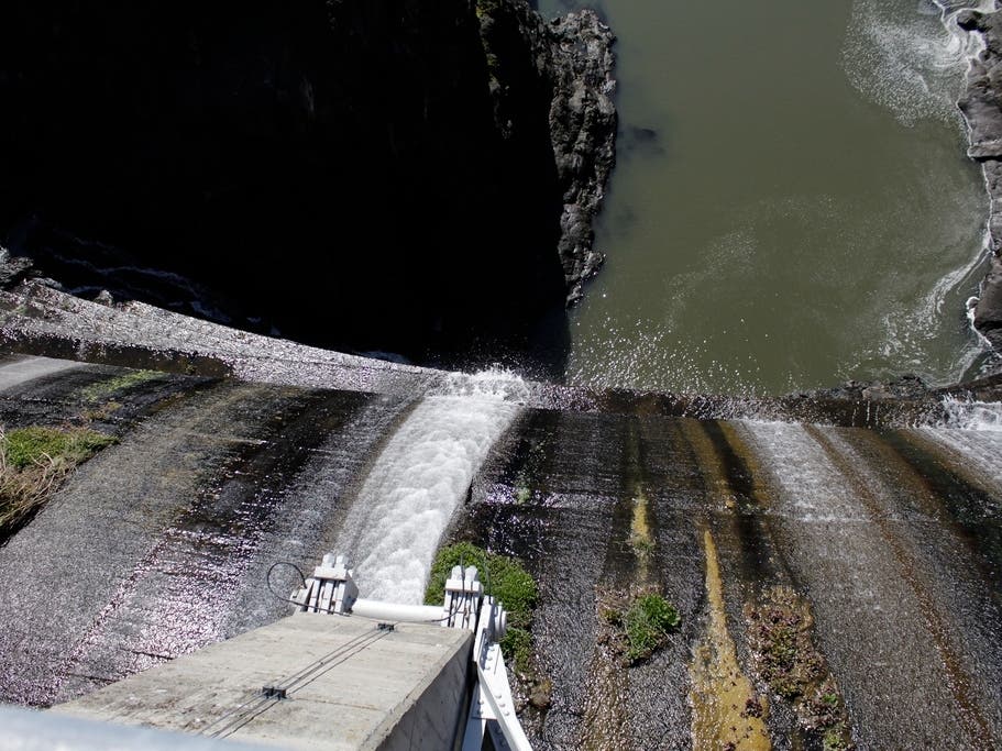 Excess water spills over the top of a dam on the Lower Klamath River known as Copco 1 near Hornbrook, Calif.
