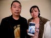 Ronggao Zhang, left, and Lifeng Ye, display a photo of them with their missing daughter, Yingying Zhang, in Urbana.