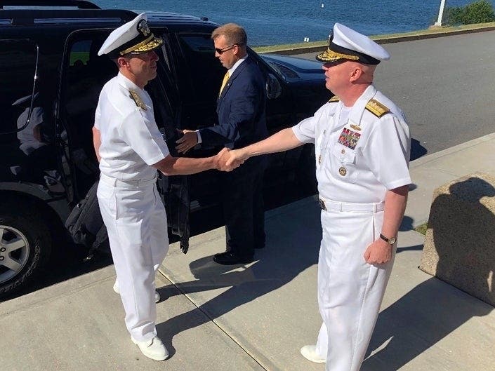 Adm. John Richardson (left,) chief of naval operations, greets Rear Adm. Jeffrey Harley.