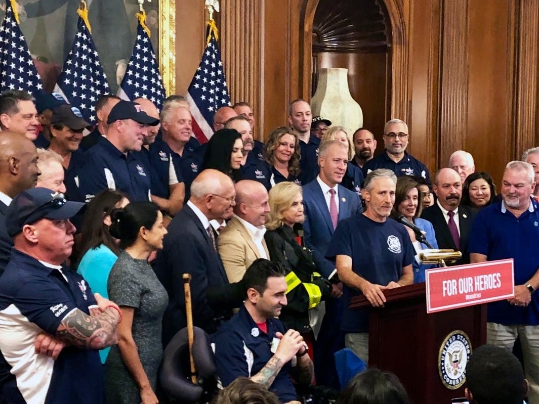 Jon Stewart speaks at a news conference on behalf of 9/11 victims and families, Friday, July 1