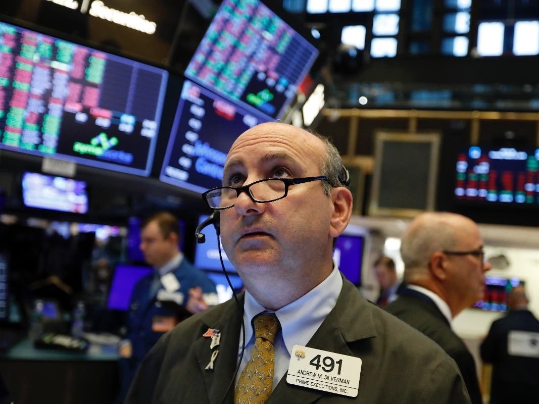 Stocks sank Wednesday after the bond market threw up one of its last remaining warning flags on the economy.