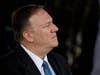 Secretary of State Mike Pompeo listens as President Donald Trump speaks during an Armed Forces welcome ceremony for the new chairman of the Joint Chiefs of Staff Gen. Mark Milley on Monday at Joint Base Myer-Henderson Hall, Virginia.