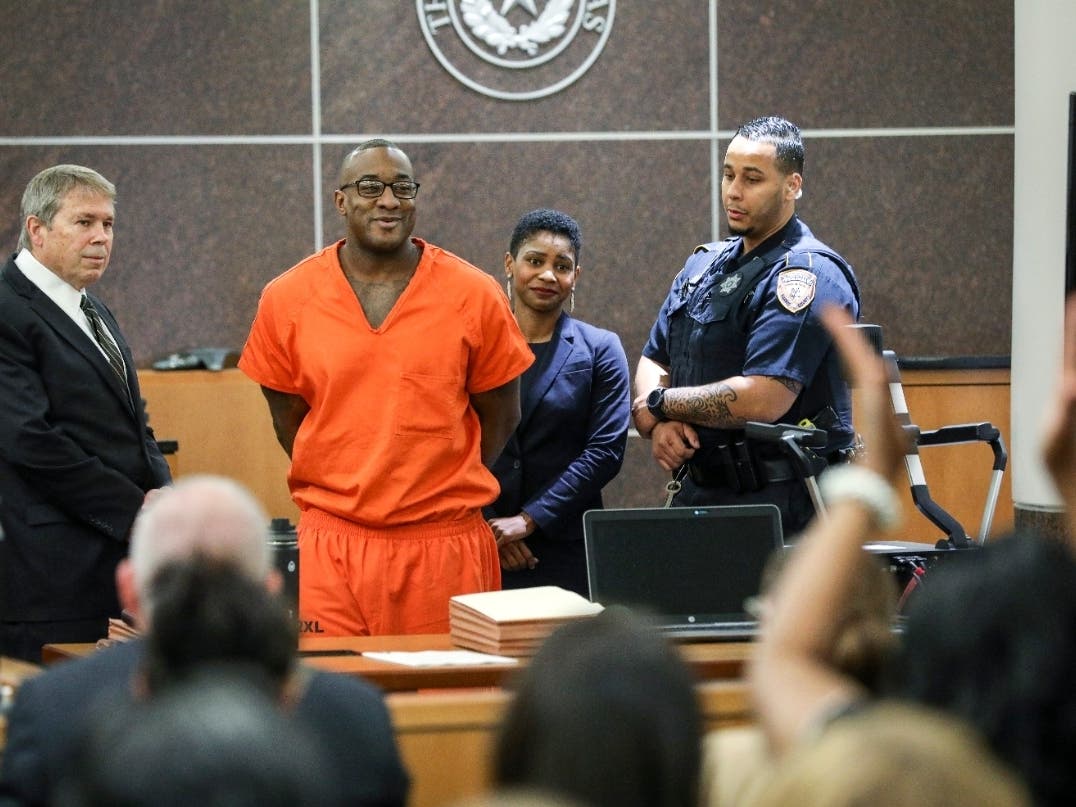 Lydell Grant, second from left, smiles in court after he was ordered to be released on bond on Tuesday, Nov. 26, 2019, in Houston.