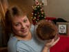 Julie Ruttinger of Tecumseh, Michigan, holds a 141-year-old fruitcake, a family heirloom baked by her great-great-grandmother, Fidelia Ford, in 1878.