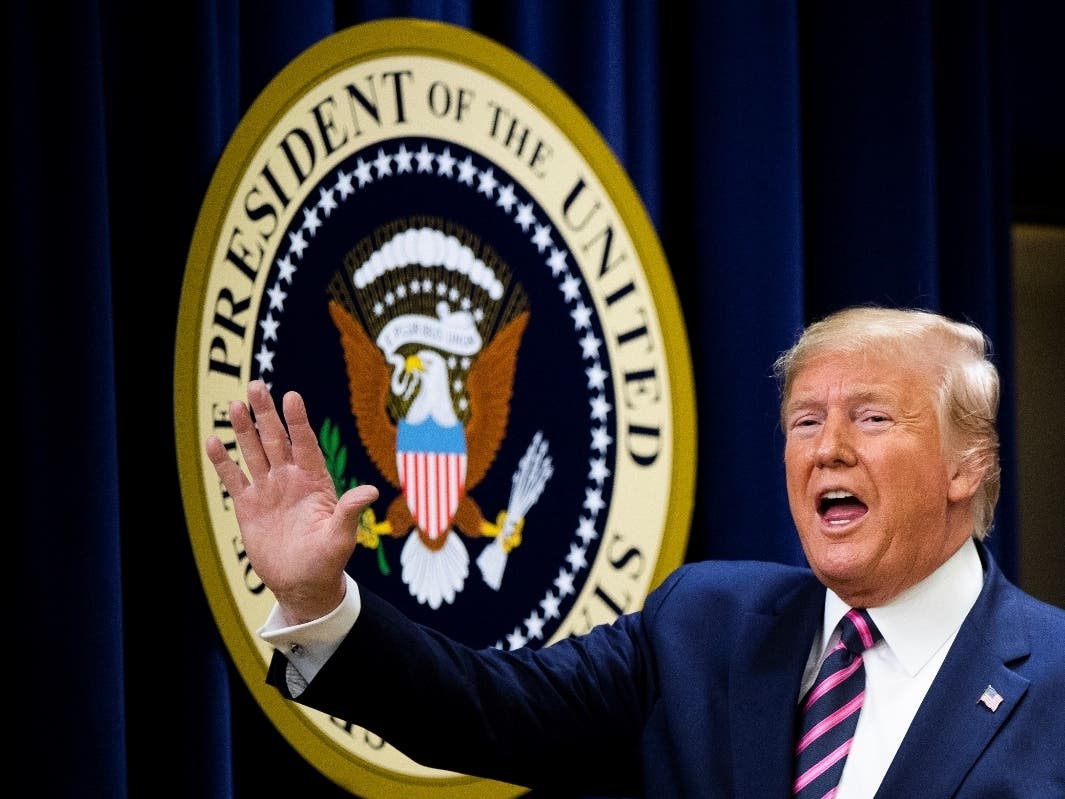 President Donald Trump gestures during a summit Thursday in Washington on transforming mental health treatment to combat homelessness, violence, and substance abuse.