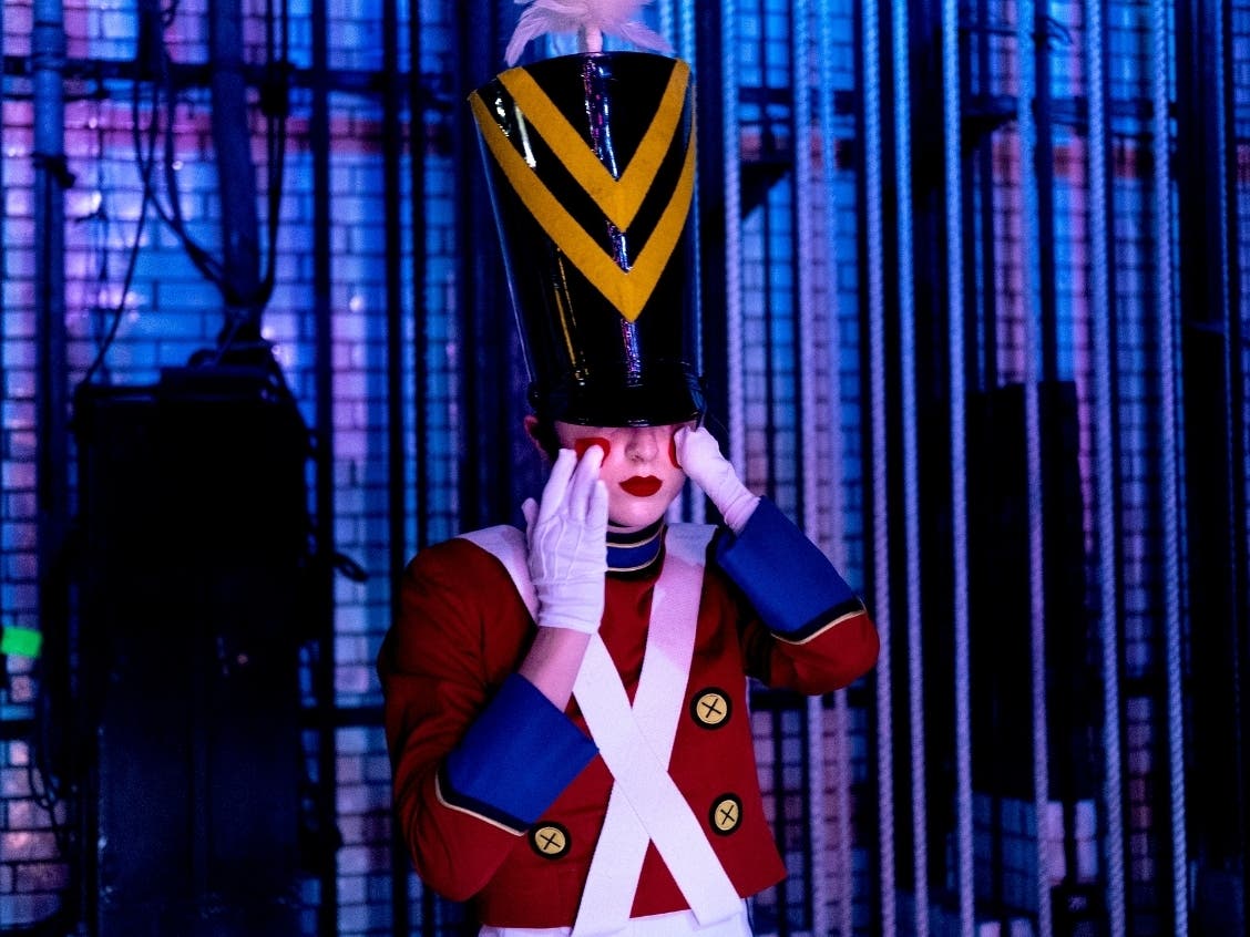 In this Monday, Nov. 25, 2019 photo, Rockette Sydney Mesher adjusts part of her Wooden Solider costume backstage during a performance of the Christmas Spectacular at Radio City Music Hall in New York. 