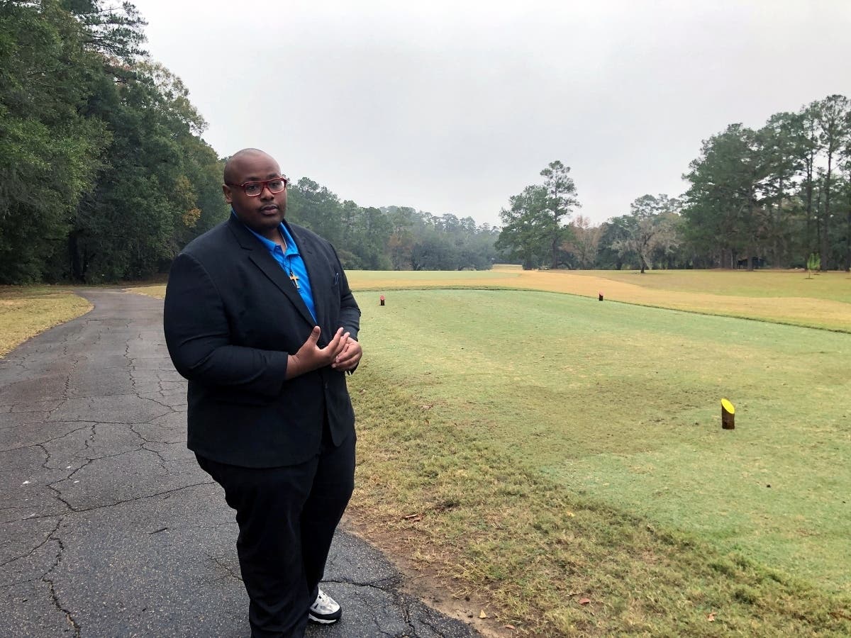 Delaitre Hollinger, the immediate past president of the Tallahassee branch of the NAACP, visits the Capital City Country Club in Tallahassee, Fla., on Dec. 17 near the site of at least 40 graves.