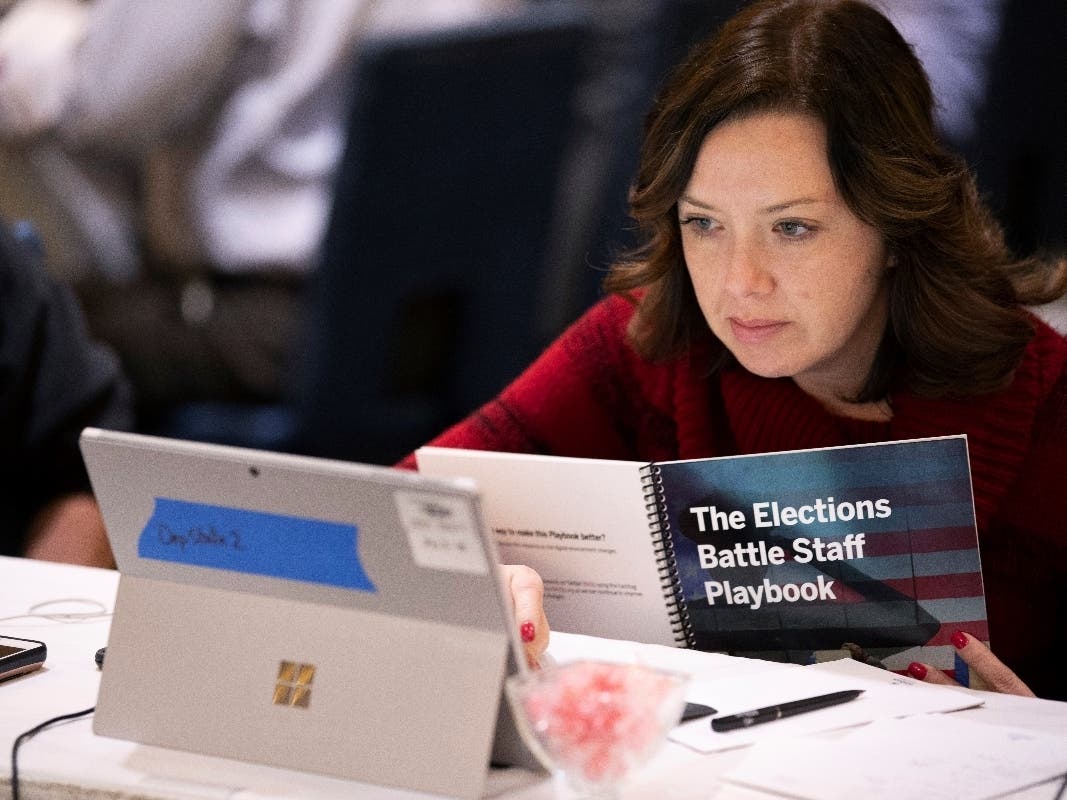 Mandy Vigil of New Mexico works during a Dec. 12 exercise in Springfield, Va., run by military and national security officials to help state and local election officials simulate different scenarios for the 2020 elections. 