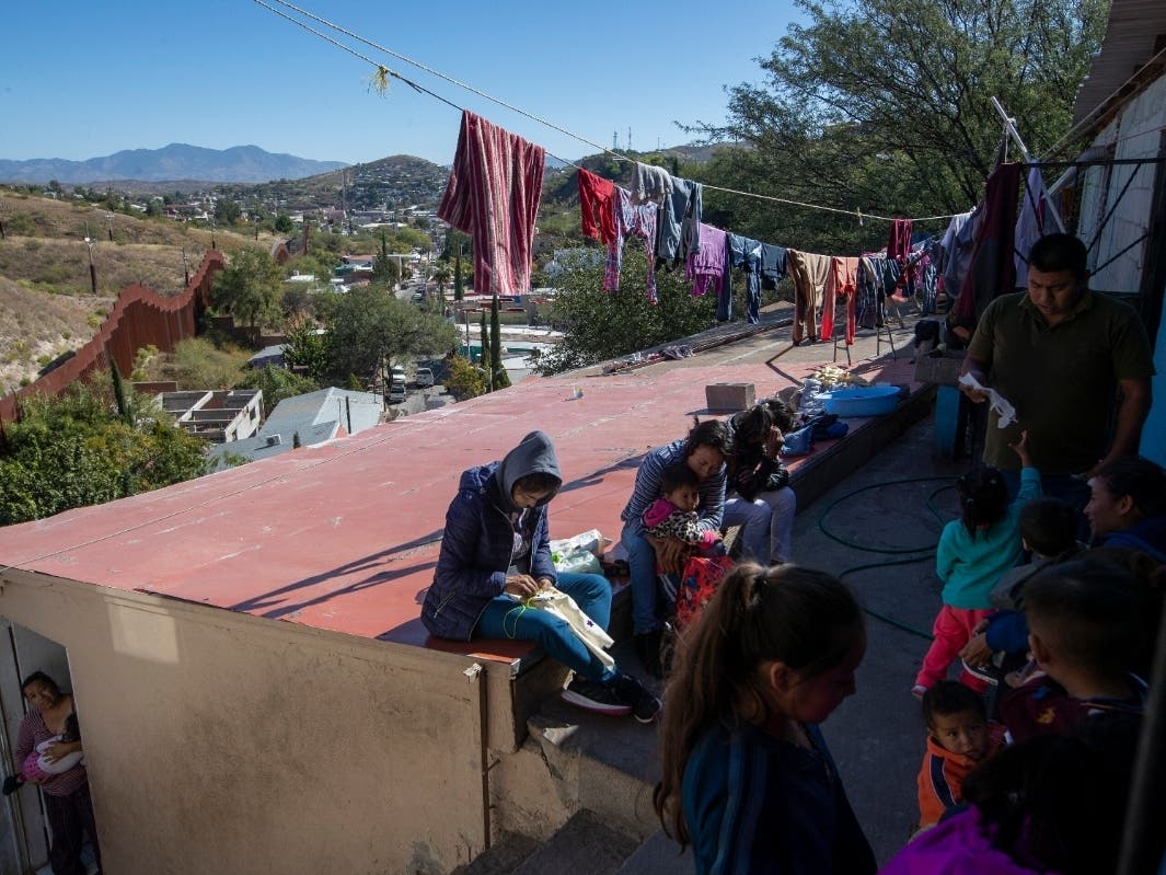 Migrants rest at "La Roca," or The Rock shelter in Nogales, Sonora state, Mexico, near the border fence that separates Mexico from the United States, which has moved aggressively over the past year to limit asylum seekers arriving at its southwest border.
