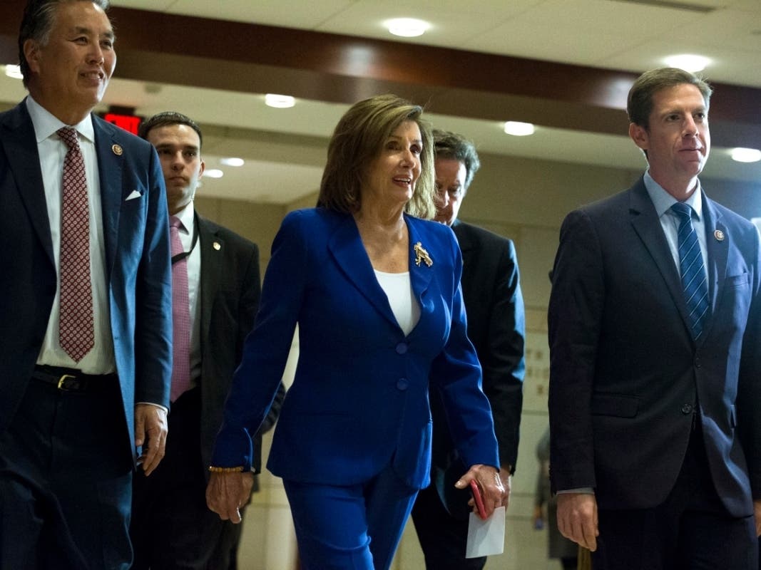 Speaker of the House Nancy Pelosi, a California Democrat, accompanied by members of the Congress arrive Wednesday on Capitol Hill for a briefing on last week's targeted killing of Iran's senior military commander Gen. Qassem Soleimani.