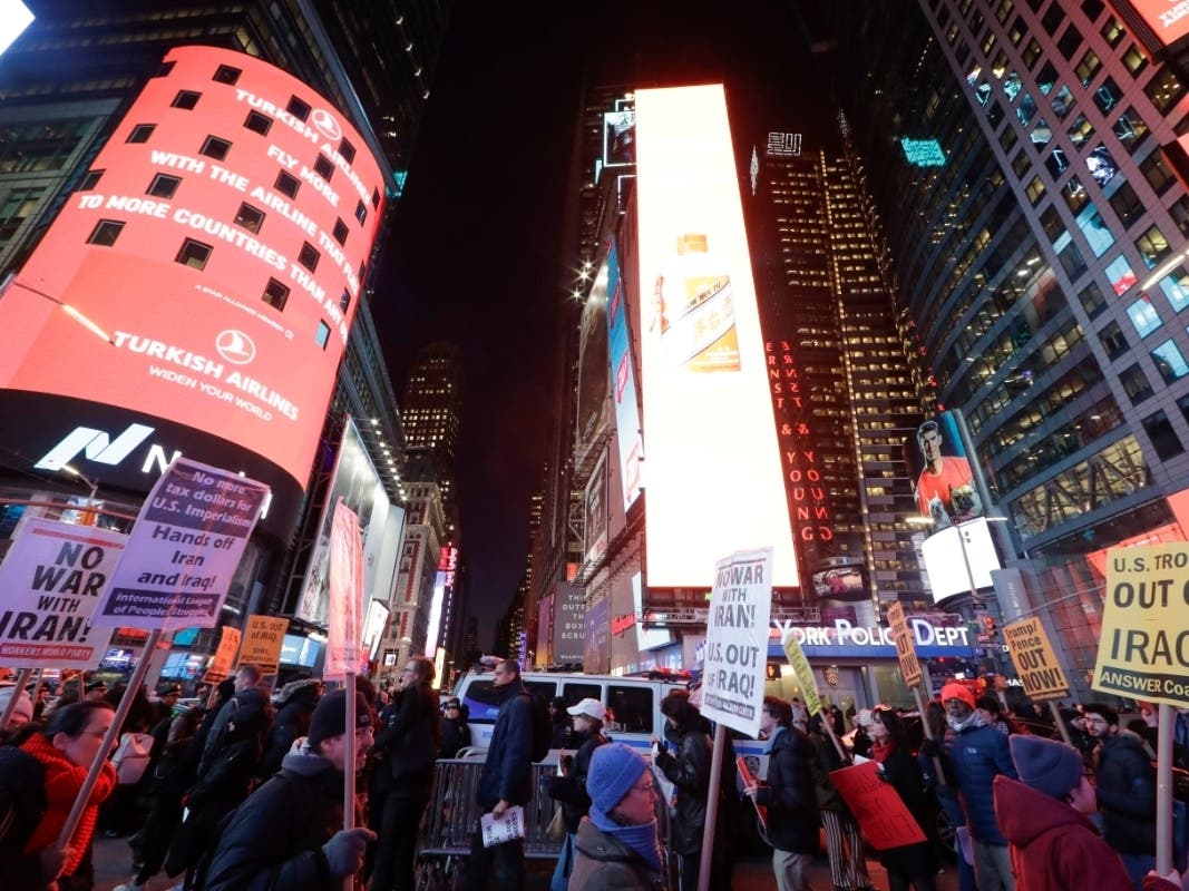 Protesters gathered in New York City's Times Square Wednesday urging the United States not to escalate rising tensions with Iran, which launched two missiles on Iraqi military bases housing U.S. troops.Color